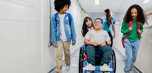 student in hallway - one in wheelchair