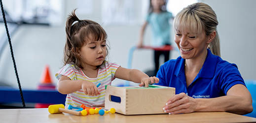 student working with physio therapist