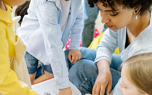 Teacher Reading Students