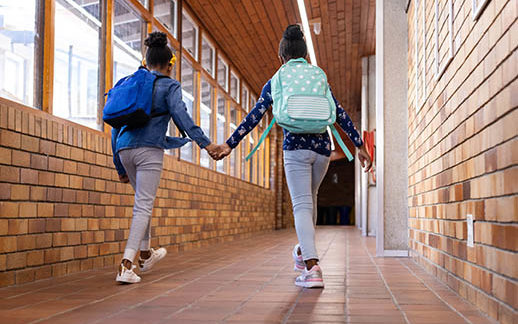 Students Holding Hands Hallway